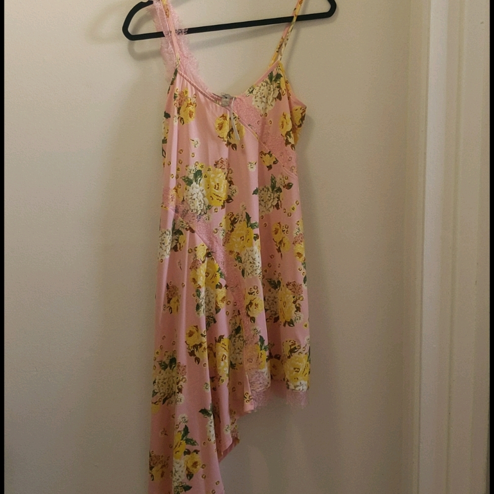 Floral print dress with asymmetrical hem.